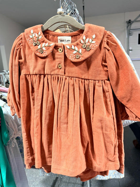 Rust corduroy dress with embroidered detail